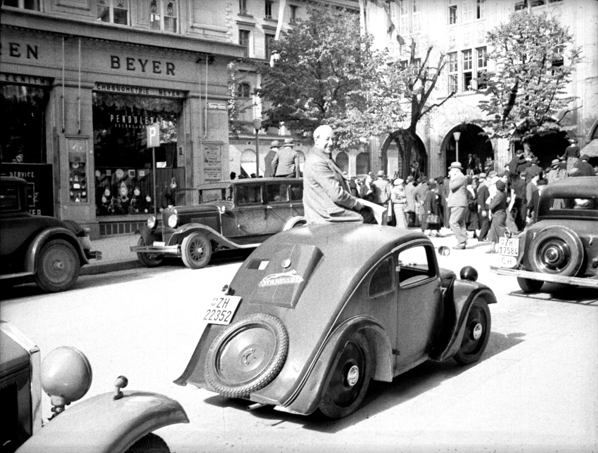 Josef Ganz sitting on the rooftop of a Standard Superior Type 2 in Zurich, 1936